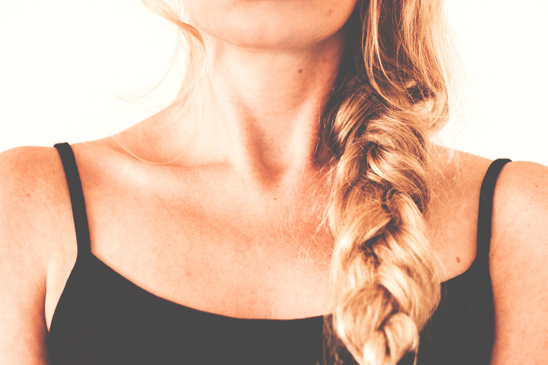 woman in black tank top with braided hair